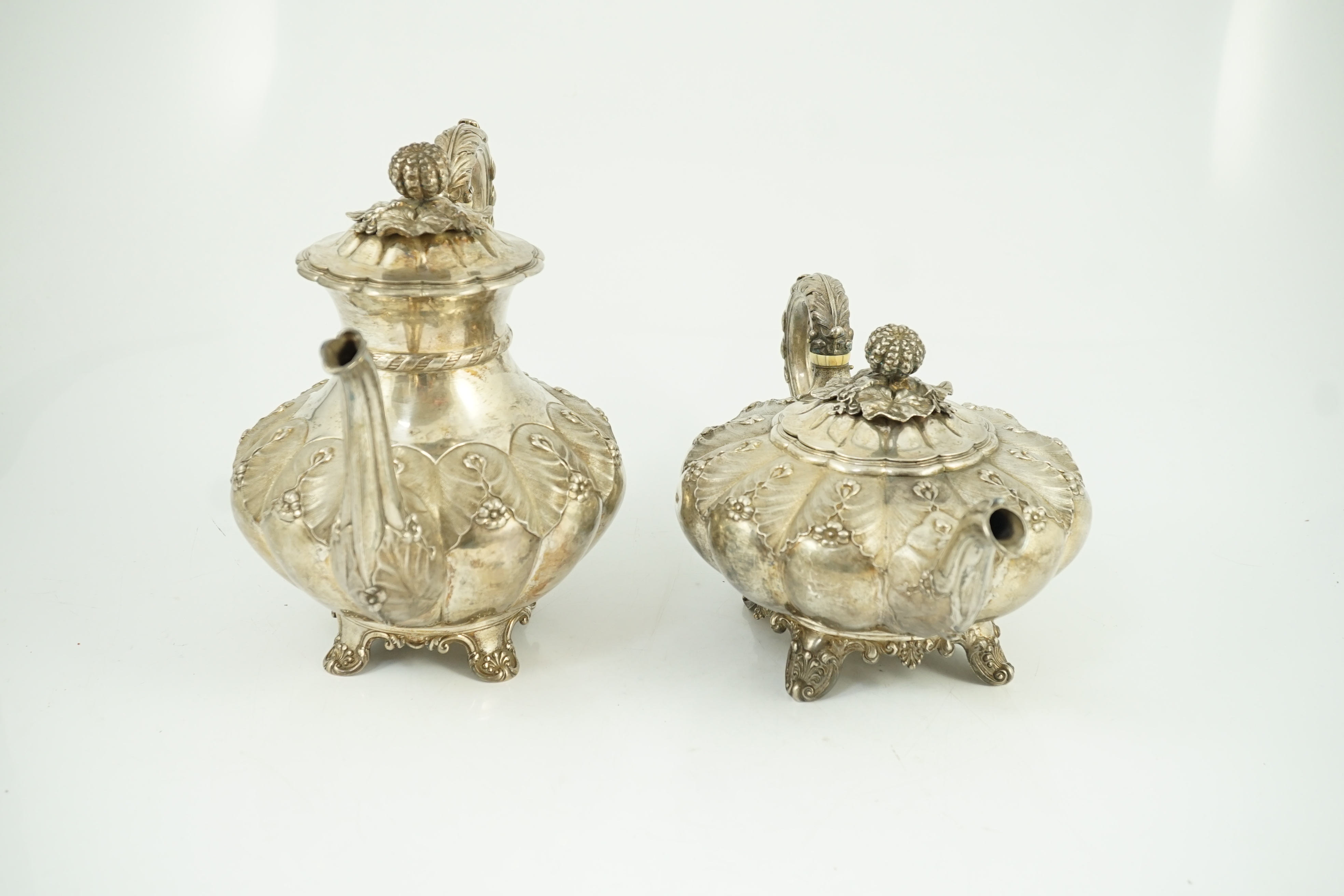 A George IV silver melon shaped coffee pot and matching tea pot by The Barnards